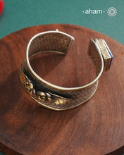 One of a kind statement wearable art pieces.Silver hand kada with a beautiful weave pattern, gold highlights and lapiz stone