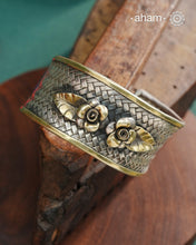 One of a kind statement wearable art pieces.Silver hand kada with a beautiful weave pattern, gold highlights and lapiz stone