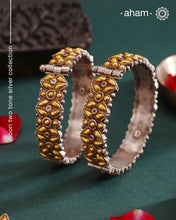 Enhance your style with the timeless elegance of the Dual Tone Silver Kada. Handcrafted by skilled karigars in Barmer, Rajasthan, this earring features traditional Bandhel work, where a thin sheet of hand beaten 22 carat gold is set on 92.5 silver using a unique wax setting technique. A classic representation of fine Indian craftsmanship