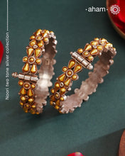 Enhance your style with the timeless elegance of the Dual Tone Silver Kada. Handcrafted by skilled karigars in Barmer, Rajasthan, this earring features traditional Bandhel work, where a thin sheet of hand beaten 22 carat gold is set on 92.5 silver using a unique wax setting technique. A classic representation of fine Indian craftsmanship.