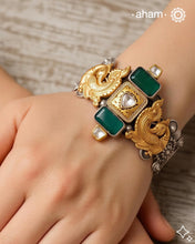 Noori two tone silver open hand cuff with a vibrant peacock motif. An eclectic mix of elements, with a play of colours, textures, forms and workmanship. Handcrafted in 92.5 Sterling Silver with two tones that make them so versatile and unique. Modern Heirloom pieces that can be worn across generations.&nbsp;