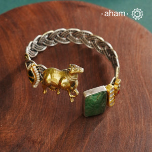 Noori Cow hand cuff with a play of colours, textures, forms and workmanship. Crafted in 92.5 Sterling Silver with two tones that make them so versatile and unique.
