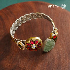 Noori hand cuff with a play of colours, textures, forms and workmanship. Crafted in 92.5 Sterling Silver with two tones that make them so versatile and unique.