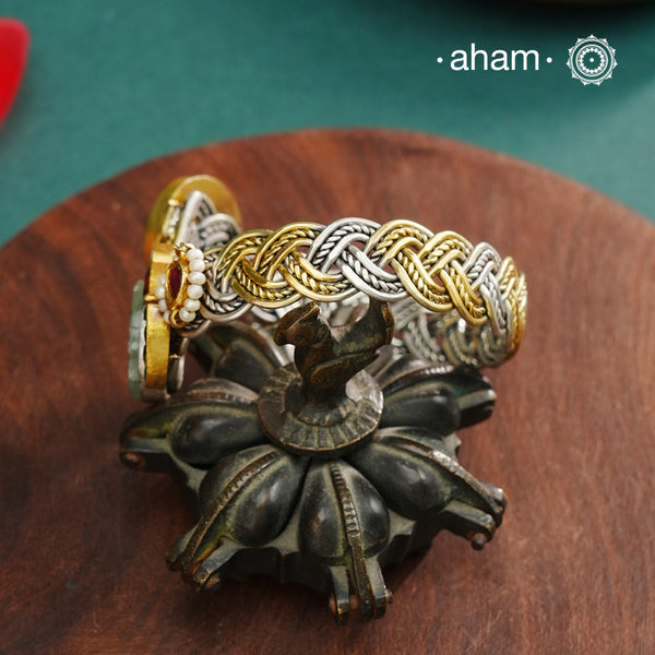 Noori hand cuff with a play of colours, textures, forms and workmanship. Crafted in 92.5 Sterling Silver with two tones that make them so versatile and unique.