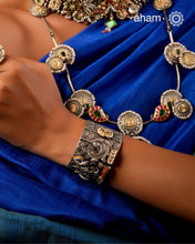 Noori hand cuff with a play of colours, textures, forms and workmanship. Crafted in 92.5 Sterling Silver with two tones, coral and kundan that make them so versatile and unique.