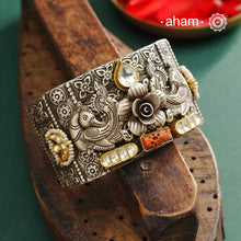 Noori hand cuff with a play of colours, textures, forms and workmanship. Crafted in 92.5 Sterling Silver with two tones, coral and kundan that make them so versatile and unique.