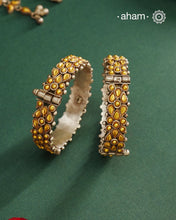 Enhance your style with the timeless elegance of the Dual Tone Silver Kada. Handcrafted by skilled karigars in Barmer, Rajasthan, this earring features traditional Bandhel work, where a thin sheet of hand beaten 22 carat gold is set on 92.5 silver using a unique wax setting technique. A classic representation of fine Indian craftsmanship.
Comes as a pair.