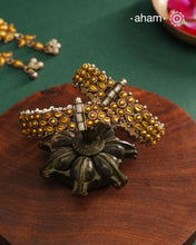 Enhance your style with the timeless elegance of the Dual Tone Silver Kada. Handcrafted by skilled karigars in Barmer, Rajasthan, this earring features traditional Bandhel work, where a thin sheet of hand beaten 22 carat gold is set on 92.5 silver using a unique wax setting technique. A classic representation of fine Indian craftsmanship.
Comes as a pair.