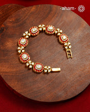 Handcrafted in 92.5 silver with a gold polish finish, this elegant bracelet features dazzling moissanite stones, floral motifs, and vibrant red accents. A timeless statement piece designed to elevate festive, wedding, and occasion wear.