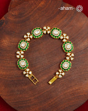 Handcrafted in 92.5 silver with a gold polish finish, this elegant bracelet features dazzling moissanite stones, floral motifs, and vibrant green accents. A timeless statement piece designed to elevate festive, wedding, and occasion wear.