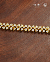 Handcrafted in 92.5 silver with a gold polish finish, this elegant tennis bracelet features dazzling moissanite stones and floral motifs. A timeless statement piece designed to elevate festive, wedding, and occasion wear.
The price is for one piece only.