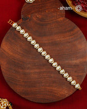 Handcrafted in 92.5 silver with a gold polish finish, this elegant tennis bracelet features dazzling moissanite stones and floral motifs. A timeless statement piece designed to elevate festive, wedding, and occasion wear.
The price is for one piece only.&nbsp;