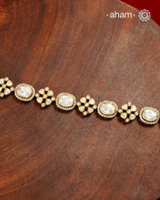 Handcrafted in 92.5 silver with a gold polish finish, this elegant tennis bracelet features dazzling moissanite stones and floral motifs. A timeless statement piece designed to elevate festive, wedding, and occasion wear.
The price is for one piece only.