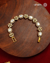 Handcrafted in 92.5 silver with a gold polish finish, this elegant tennis bracelet features dazzling moissanite stones and floral motifs. A timeless statement piece designed to elevate festive, wedding, and occasion wear.
The price is for one piece only.&nbsp;