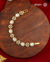 Handcrafted in 92.5 silver with a gold polish finish, this elegant tennis bracelet features dazzling moissanite stones and floral motifs. A timeless statement piece designed to elevate festive, wedding, and occasion wear.
The price is for one piece only.&nbsp;
