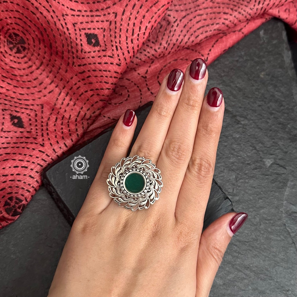 Handcrafted Mewad adjustable ring in 92.5 sterling silver with a beautiful green glass center. 