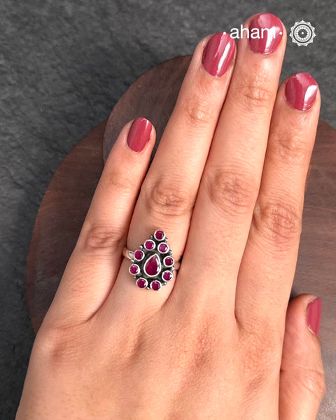 Summer Love Flower Silver Ring in 92.5 sterling silver with maroon Stone setting.
A versatile ring that works great with your Indian outfits.