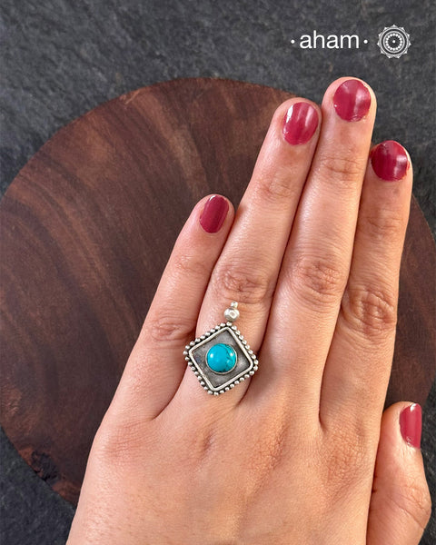 Adjustable ring in 92.5 sterling silver with turquoise highlight.A versatile ring that works with most outfits.