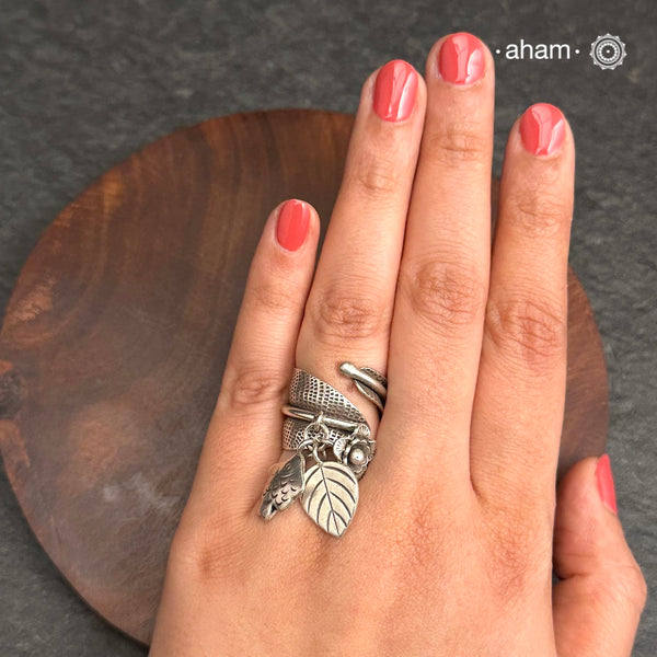 Adjustable Ring in 92.5 sterling silver with different charms.
Perfect piece to add a playful tough to your look.