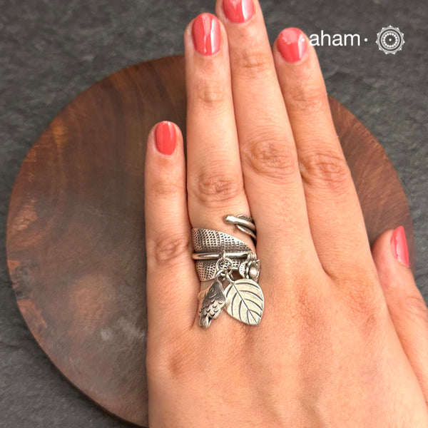 Adjustable Ring in 92.5 sterling silver with different charms.
Perfect piece to add a playful tough to your look.