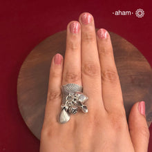 Adjustable Ring in 92.5 sterling silver with different charms.Perfect piece to add a playful tough to your look.