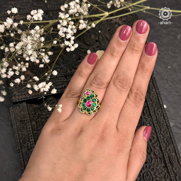 Festive gold polish adjustable ring, handcrafted in 92.5 silver with gold polish and green kundan setting. Perfect for special occasions and festivities. 