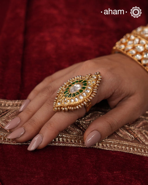 Festive gold polish adjustable ring handcrafted in silver with fine Kundan work. Perfect for special occasions and celebrations.