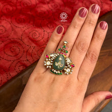 Crafted in 92.5 silver and dipped in gold polish, the Kundan Gold Polish Silver Ring features a beautiful festive design with stone inlay work, kundan setting, and delicate pearls. Perfect for adding an elegant touch to any festive occasion.