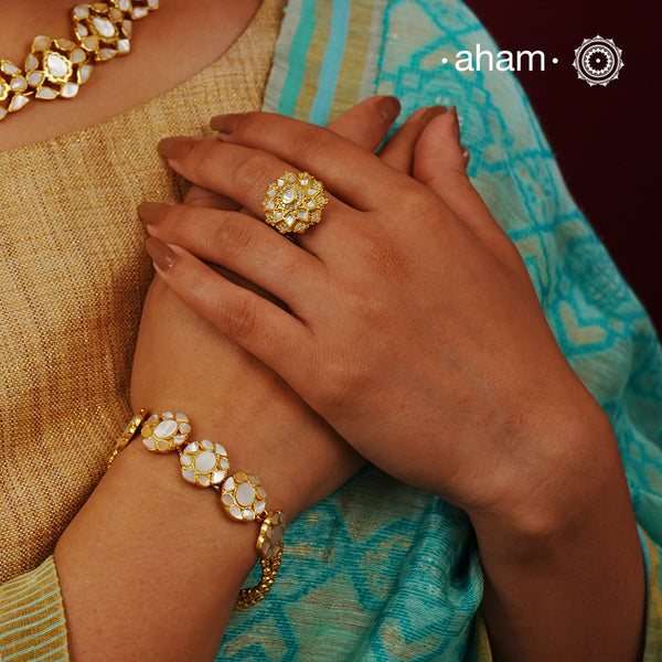 Embrace the allure of timeless elegance with Aham Jewellery’s latest Mother of Pearl collection, a radiant choice for festive celebrations and weddings.

The ring is crafted in 92.5 silver and adorned with a luxurious gold polish, capturing the iridescent beauty of mother of pearl. 
