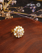 Embrace the allure of timeless elegance with Aham Jewellery’s latest Mother of Pearl collection, a radiant choice for festive celebrations and weddings.The ring is crafted in 92.5 silver and adorned with a luxurious gold polish, capturing the iridescent beauty of mother of pearl.This collection is designed with festivities, bridesmaids, and destination weddings in mind, offering a versatile blend of tradition and contemporary charm. 