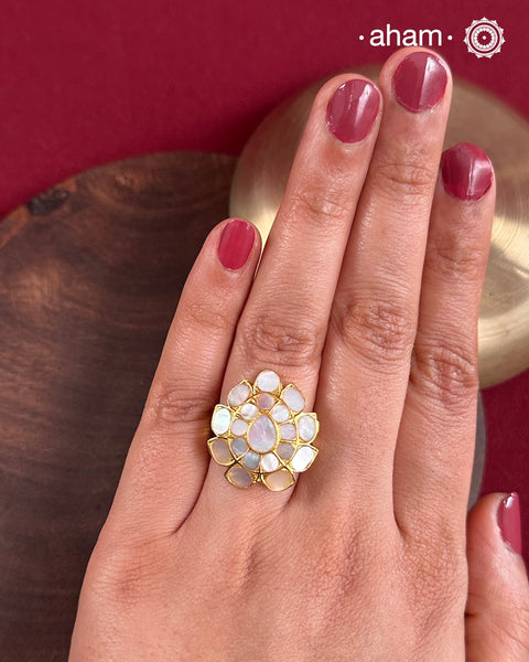 Embrace the allure of timeless elegance with Aham Jewellery’s latest Mother of Pearl collection, a radiant choice for festive celebrations and weddings.
The ring is crafted in 92.5 silver and adorned with a luxurious gold polish, capturing the iridescent beauty of mother of pearl.This collection is designed with festivities, bridesmaids, and destination weddings in mind, offering a versatile blend of tradition and contemporary charm. Ideal for those seeking an ethereal statement, our Mother of Pear