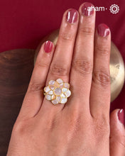 Embrace the allure of timeless elegance with Aham Jewellery’s latest Mother of Pearl collection, a radiant choice for festive celebrations and weddings.
The ring is crafted in 92.5 silver and adorned with a luxurious gold polish, capturing the iridescent beauty of mother of pearl.This collection is designed with festivities, bridesmaids, and destination weddings in mind, offering a versatile blend of tradition and contemporary charm. 