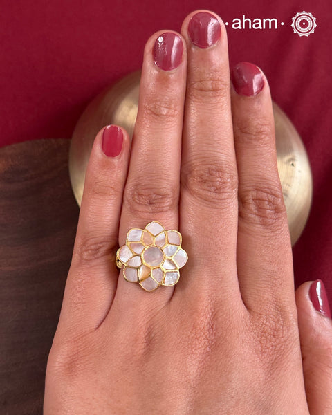 Embrace the allure of timeless elegance with Aham Jewellery’s latest Mother of Pearl collection, a radiant choice for festive celebrations and weddings.
The ring is crafted in 92.5 silver and adorned with a luxurious gold polish, capturing the iridescent beauty of mother of pearl.This collection is designed with festivities, bridesmaids, and destination weddings in mind, offering a versatile blend of tradition and contemporary charm. 