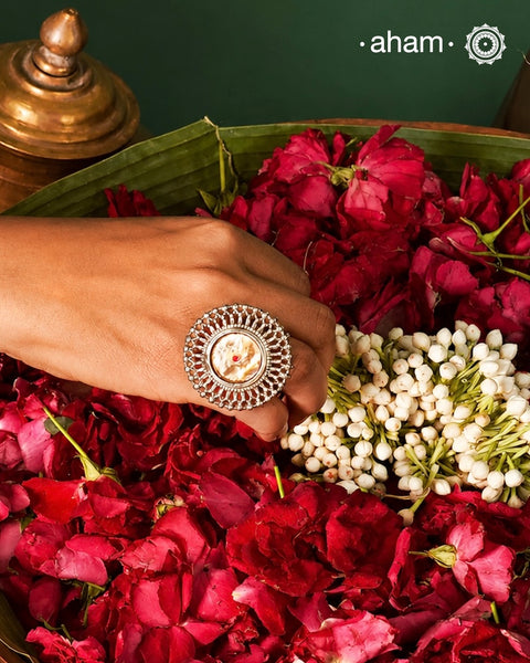 Introducing the Noori Two Tone Silver Cuff, a beautifully crafted open cuff in 92.5 silver featuring a two-tone braided band adorned with stunning green and pink kundan and parrot designs. Elevate your style with this unique and elegant piece, perfect for any occasion.

The price is for one piece kada only.
