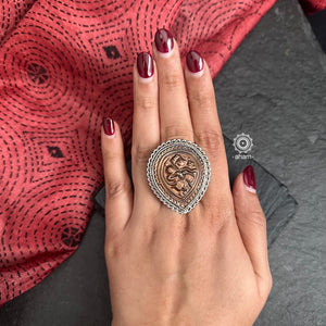 Expertly crafted, this Tribal Silver Ring boasts a beautiful Hanuman motif in copper set in a striking silver frame. The adjustable design allows for a perfect fit, making it a versatile and stylish addition to any outfit. Elevate your style with this handcrafted piece of art.