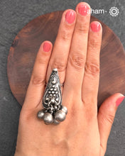 Tribal silver adjustable ring with a bunch of ghungroos.Perfect to pair with your ethnic clothing.