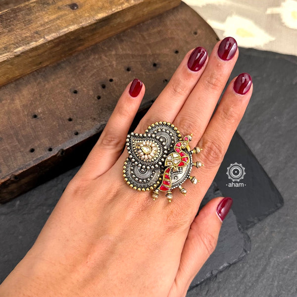 Noori two tone adjustable ring with peacock motif. Handcrafted in 92.5 sterling silver with hints of gold polish, pearls and kundan work.  Perfect to match your Indian or fusion outfit. 