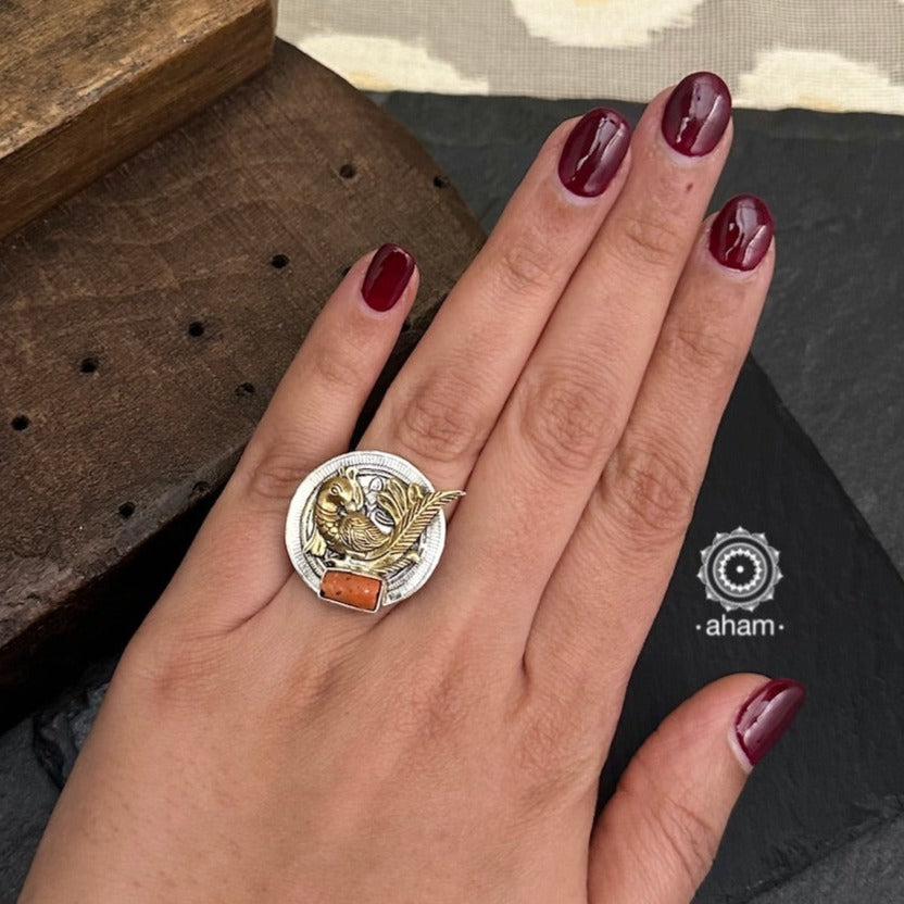 Noori two tone ring handcrafted in 92.5 sterling silver with Peacock motif and a beautiful coral ascent. 