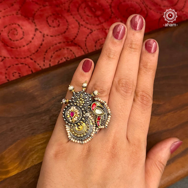 Noori two tone ring handcrafted in 92.5 sterling silver with a beautiful kundan bird motif. Handcrafted in 92.5 sterling silver with hints of gold polish and pearls. Perfect to match your Indian or fusion outfit. 