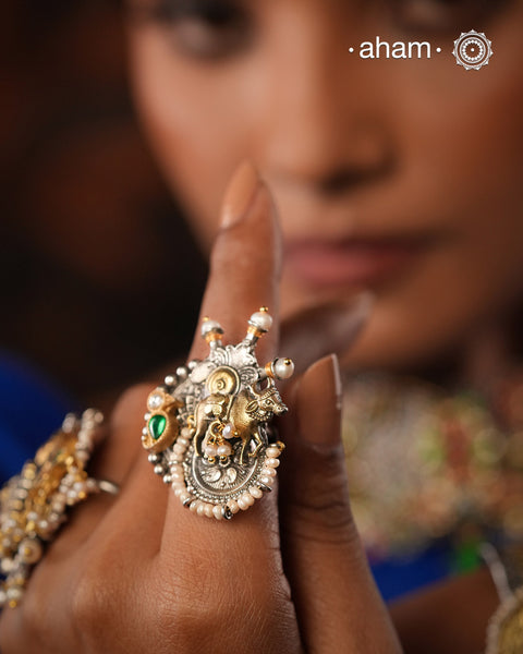 Noori two tone ring handcrafted in 92.5 sterling silver with a beautiful cow highlight. Handcrafted in 92.5 sterling silver with hints of gold polish and pearls.Perfect to match your Indian or fusion outfit.