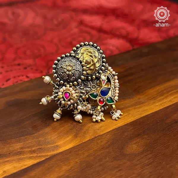 Noori two tone ring handcrafted in 92.5 sterling silver with a beautiful kundan peacock motif. Handcrafted in 92.5 sterling silver with hints of gold polish and pearls. Perfect to match your Indian or fusion outfit.