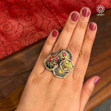 Noori two tone finger ring handcrafted in 92.5 sterling silver with a beautiful kundan peacock. Handcrafted in 92.5 sterling silver with hints of gold polish and pearls. Perfect to match your Indian or fusion outfit.