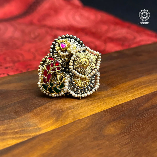 Noori two tone finger ring handcrafted in 92.5 sterling silver with a beautiful kundan peacock. Handcrafted in 92.5 sterling silver with hints of gold polish and pearls. Perfect to match your Indian or fusion outfit.