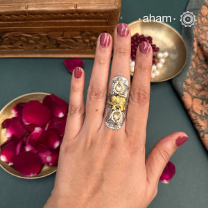 Noori two tone adjustable ring with elephant motif. Handcrafted in 92.5 sterling silver withhints of gold polish, pearls and kundan work. Perfect to match your Indian or fusion outfit.