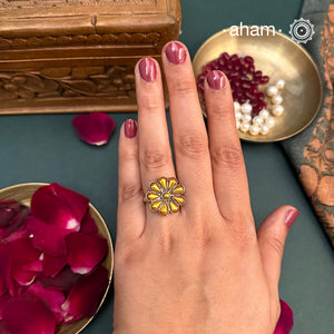 Enhance your style with the timeless elegance of the Two Tone Silver Ring. Handcrafted by skilled karigars in Barmer, Rajasthan, this ring features traditional Bandhel work, where a thin sheet of 22 carat hand beaten gold is set on silver using a unique wax filling technique. A classic representation of Indian craftsmanship.