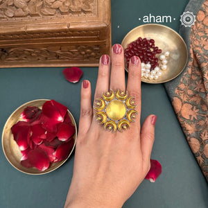 Enhance your style with the timeless elegance of the Two Tone Silver Ring. Handcrafted by skilled karigars in Barmer, Rajasthan, this ring features traditional Bandhel work, where a thin sheet of 22 carat hand beaten gold is set on silver using a unique wax filling technique. A classic representation of Indian craftsmanship.