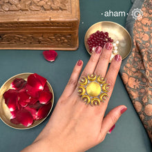 Enhance your style with the timeless elegance of the Two Tone Silver Ring. Handcrafted by skilled karigars in Barmer, Rajasthan, this ring features traditional Bandhel work, where a thin sheet of 22 carat hand beaten gold is set on silver using a unique wax filling technique. A classic representation of Indian craftsmanship.