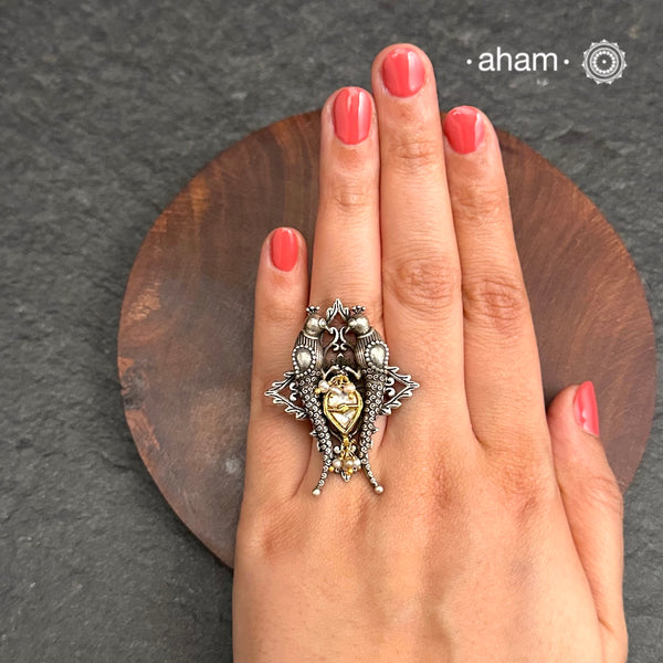Noori two tone adjustable ring with Parrot motif. Handcrafted in 92.5 sterling silver with hints of gold polish, pearls and kundan work. Perfect to match your Indian or fusion outfit.