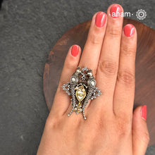 Noori two tone adjustable ring with Parrot motif. Handcrafted in 92.5 sterling silver with hints of gold polish, pearls and kundan work. Perfect to match your Indian or fusion outfit.