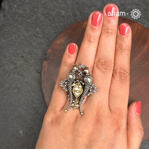 Noori two tone adjustable ring with Parrot motif. Handcrafted in 92.5 sterling silver with hints of gold polish, pearls and kundan work. Perfect to match your Indian or fusion outfit.